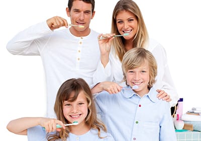 happy family brushing their teeth