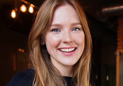 smiling midle aged red head woman